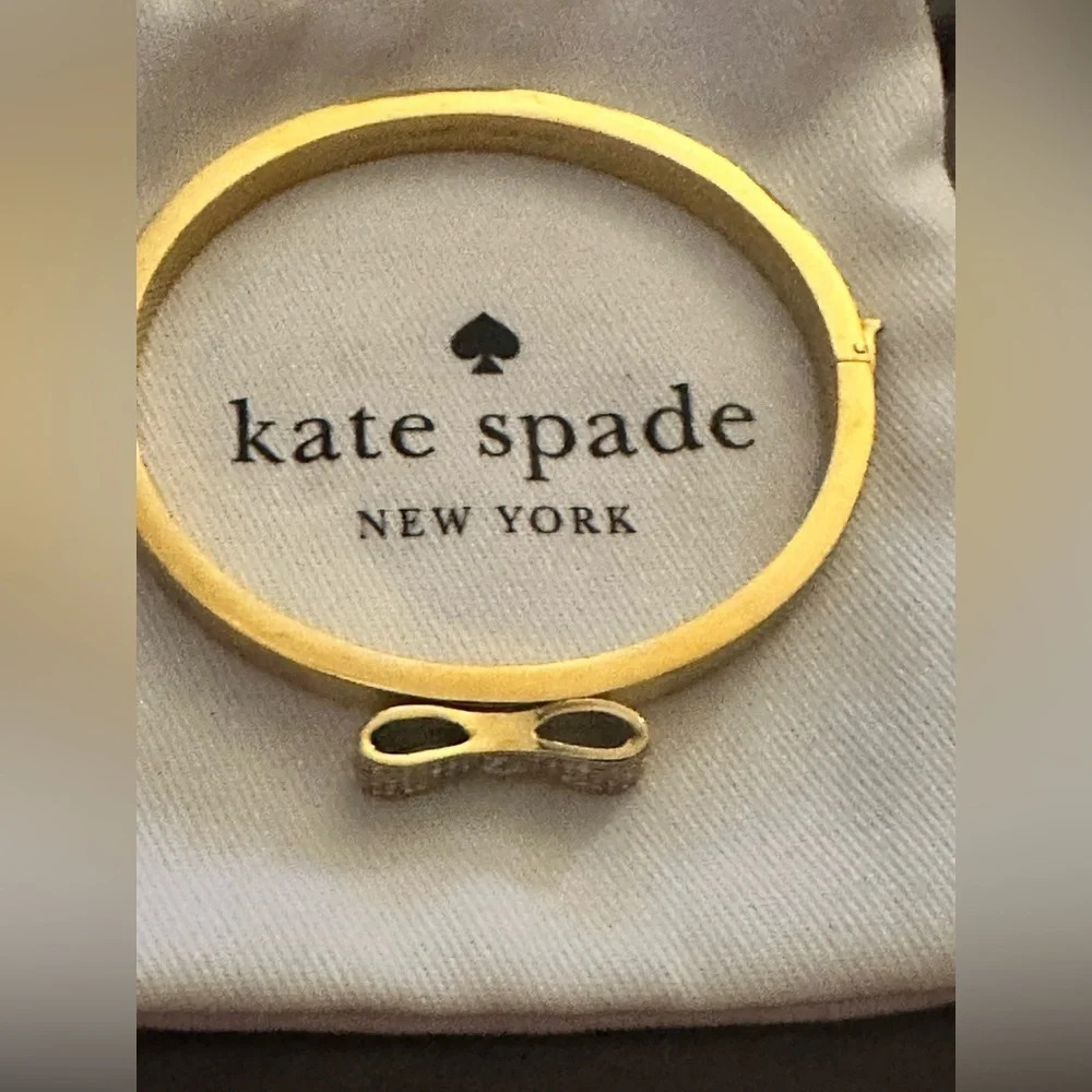 Kate Spade gold bangle bracelet with rhinestone bow